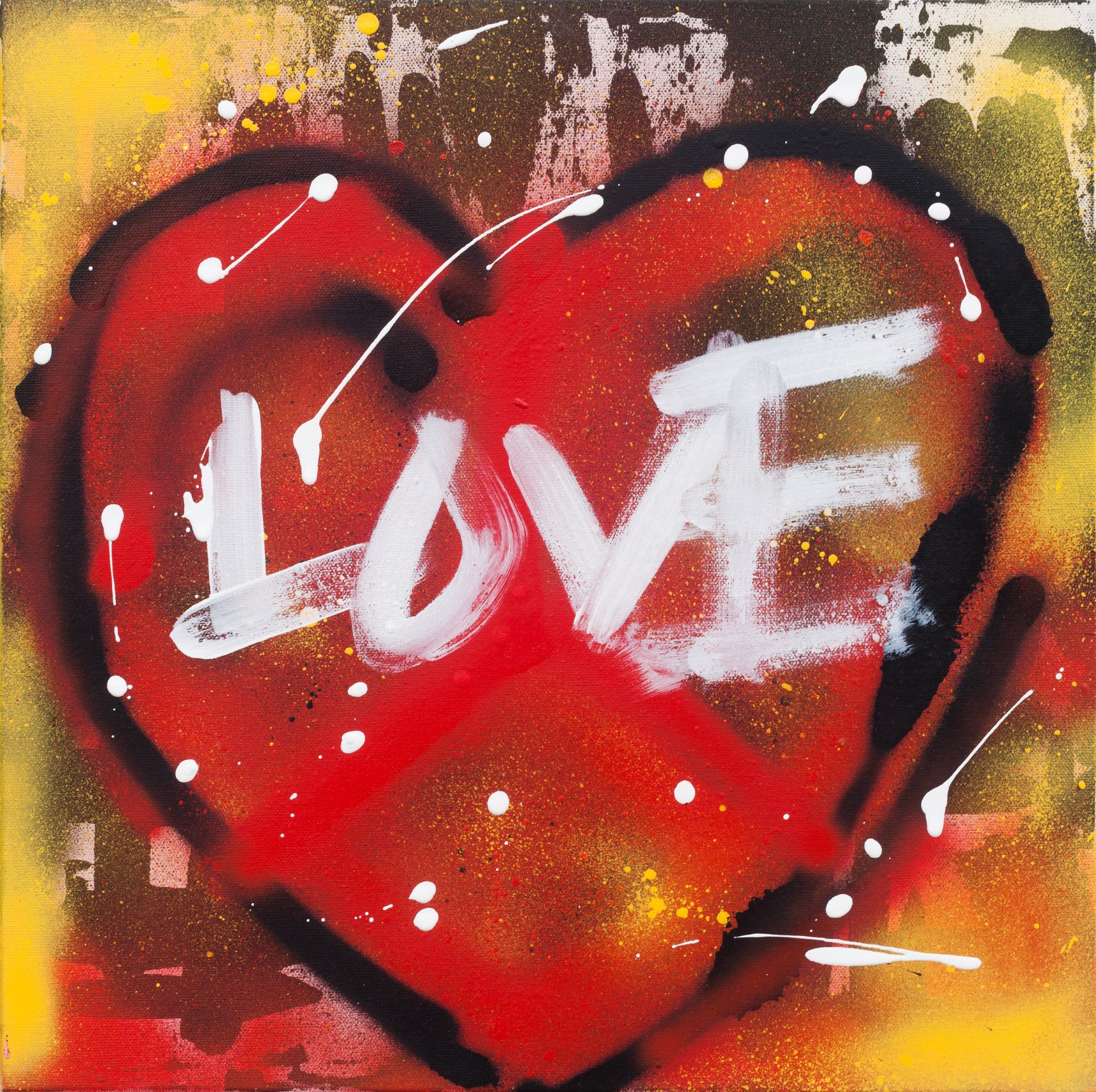 Spray-painted red heart with the word Love in white over a yellow and red background
